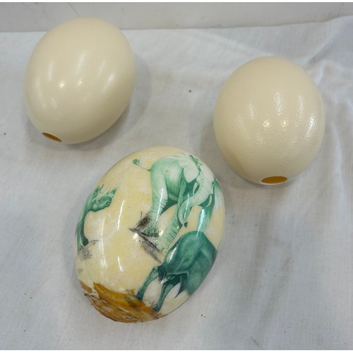 227 - Two ostrich eggs and a hand painted signed egg
