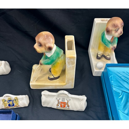 252 - Selection of cricket pottery items to include novelty book ends, Coalport plates etc