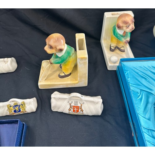 252 - Selection of cricket pottery items to include novelty book ends, Coalport plates etc