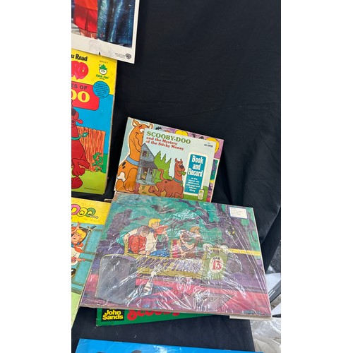 128 - Large selection of childrens vintage Scooby Doo items to include books, jigsaws, stickers etc