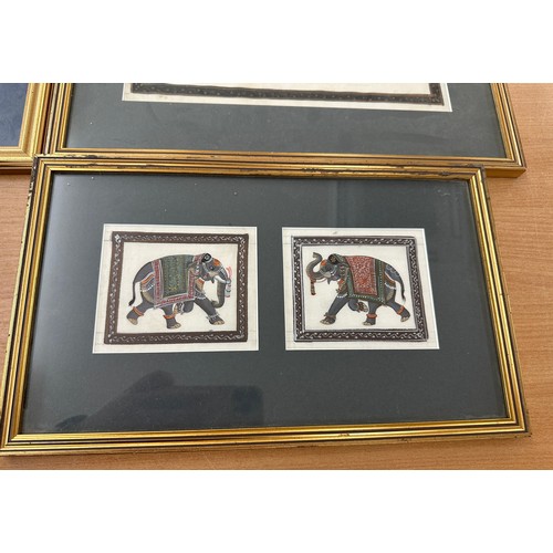 126 - Selection of framed hand painted elephants on cloth largest measures 16.5 inches tall by 20 inches w... 