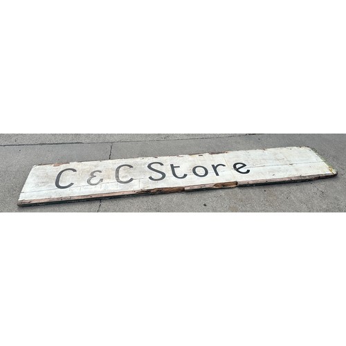 100 - Vintage wooden shop sign ' C&C Store' measures approx 107 inches long by 19 inches tall