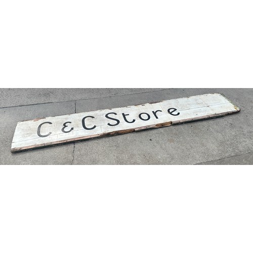 100 - Vintage wooden shop sign ' C&C Store' measures approx 107 inches long by 19 inches tall