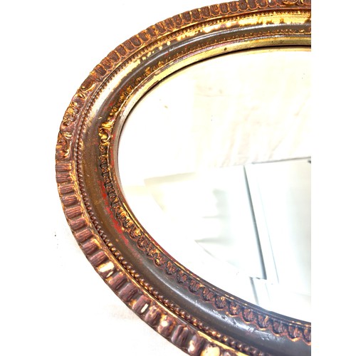 76 - Vintage gilt framed oval wall mirror, approximate measurements: 15 x 19 inches