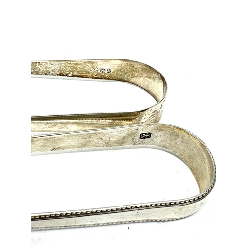 16 - 2 georgian silver sugar tongs