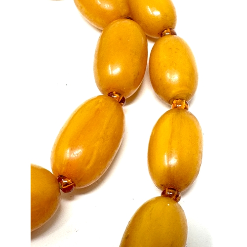 41 - Vintage Amber / bakelite bead necklace internal streaking weight 70g