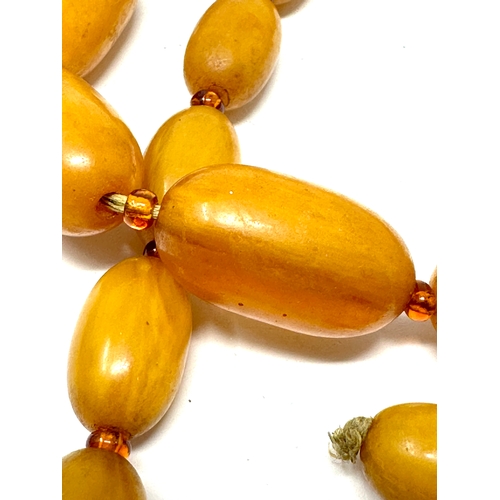 41 - Vintage Amber / bakelite bead necklace internal streaking weight 70g