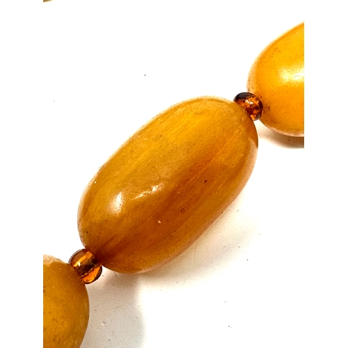 41 - Vintage Amber / bakelite bead necklace internal streaking weight 70g