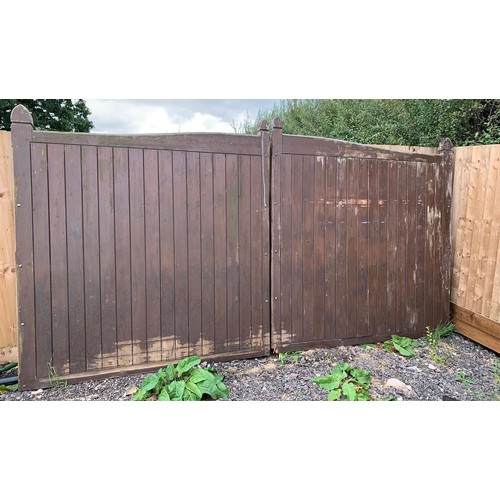 100A - Two large outdoor wooden gates each gate measures approx 2 metres high by 2 metres wide