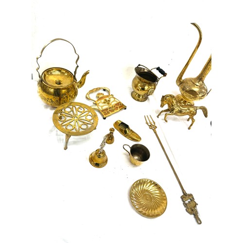 43 - Selection of brass ware includes dallah, kettle and stand etc