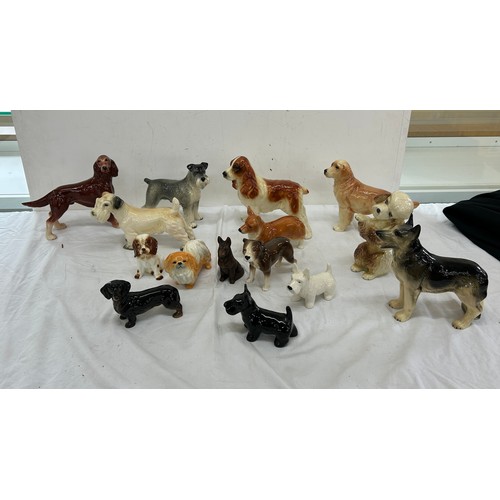 62 - Selection of assorted dog figures includes cooper craft etc