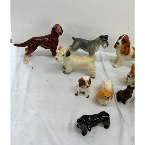 62 - Selection of assorted dog figures includes cooper craft etc