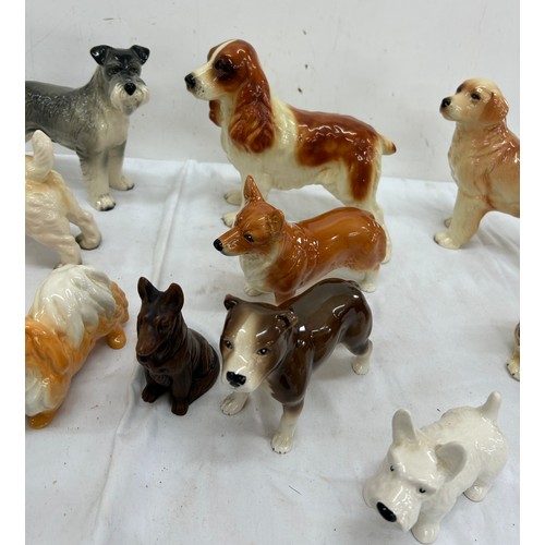 62 - Selection of assorted dog figures includes cooper craft etc