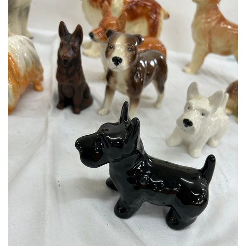 62 - Selection of assorted dog figures includes cooper craft etc