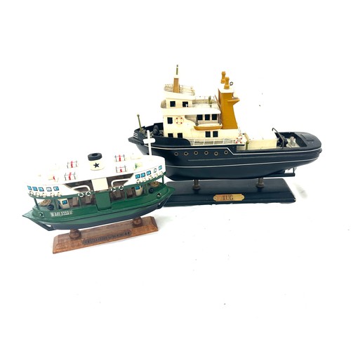 37 - 2 Model tug boats on stand, star berry con con