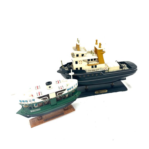 37 - 2 Model tug boats on stand, star berry con con