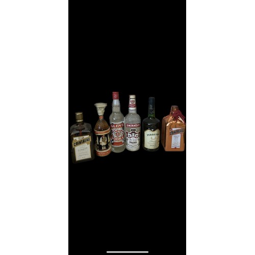 589 - Selection of sealed Vodka and Liquers to include Smirnoff, Cointreau etc