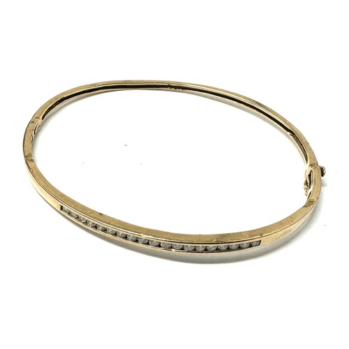 98 - 9ct Gold Channel Set Diamond Bangle (5.4g) o.40ct diamonds