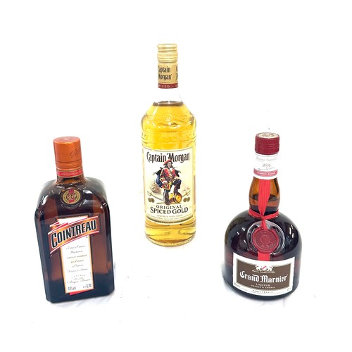 592 - Selection of alcohol to include Captain Morgan original spiced rum 1L, Cointreau 40% liquor and one ... 