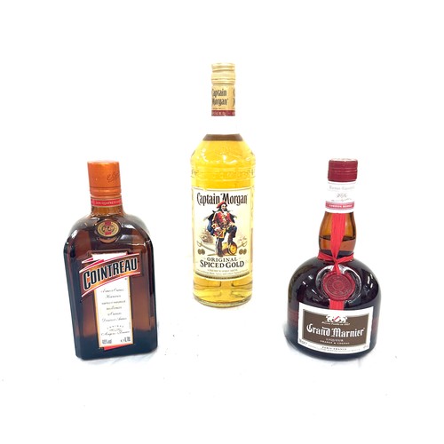 592 - Selection of alcohol to include Captain Morgan original spiced rum 1L, Cointreau 40% liquor and one ... 