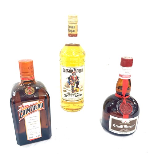 592 - Selection of alcohol to include Captain Morgan original spiced rum 1L, Cointreau 40% liquor and one ... 