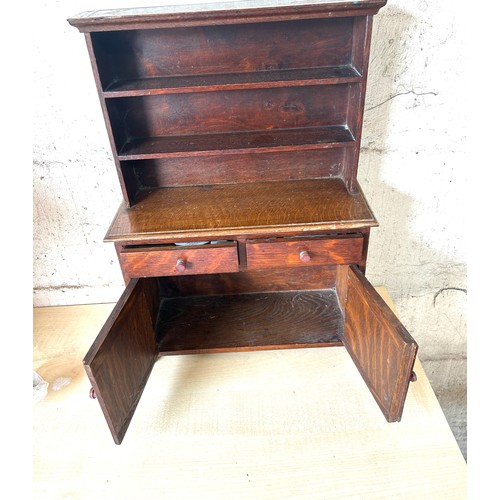 64A - Miniature oak 2 door, 2 drawer Welsh dresser, Height 18 inches, Width 13 inches, Depth 5.5 inches