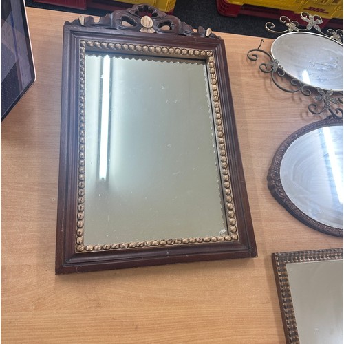 57 - Selection of 4 mirrors largest measures approximately 26 inches by 17 inches wide