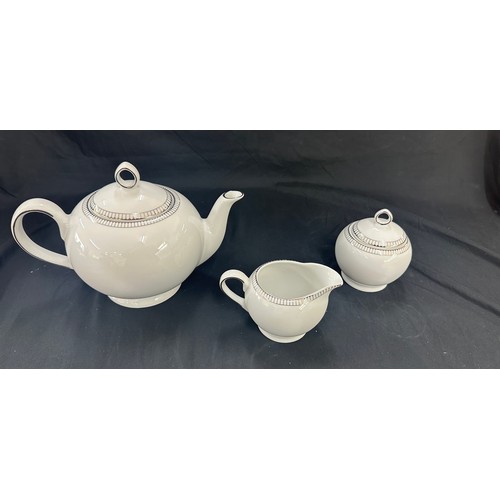 589 - Three pieces of Royal Doulton paramount platinum a tea pot, sugar bowl and milk jug