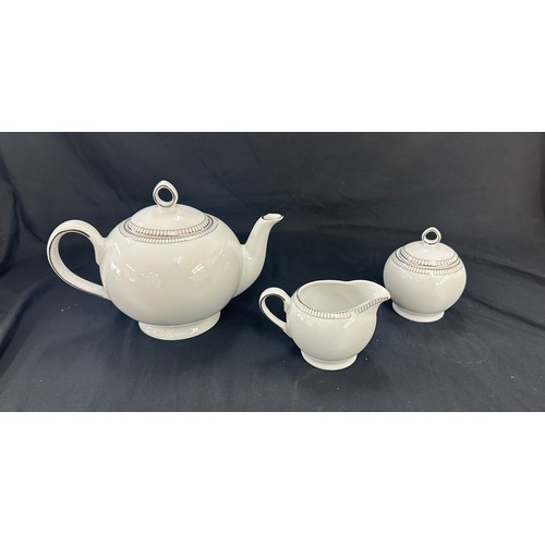 589 - Three pieces of Royal Doulton paramount platinum a tea pot, sugar bowl and milk jug