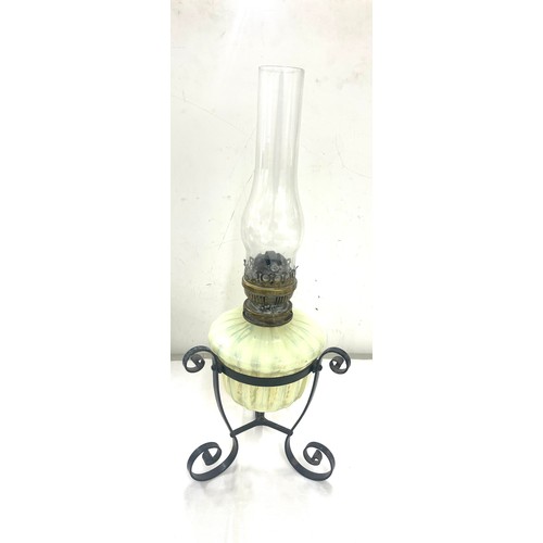 272 - Antique wrought iron and Vasaline glass oil lamp, 22 inches tall