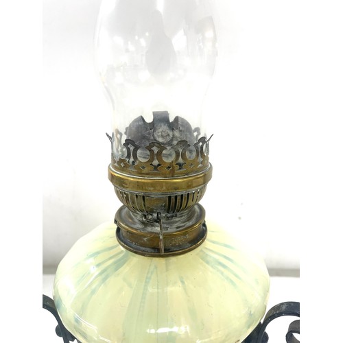 272 - Antique wrought iron and Vasaline glass oil lamp, 22 inches tall