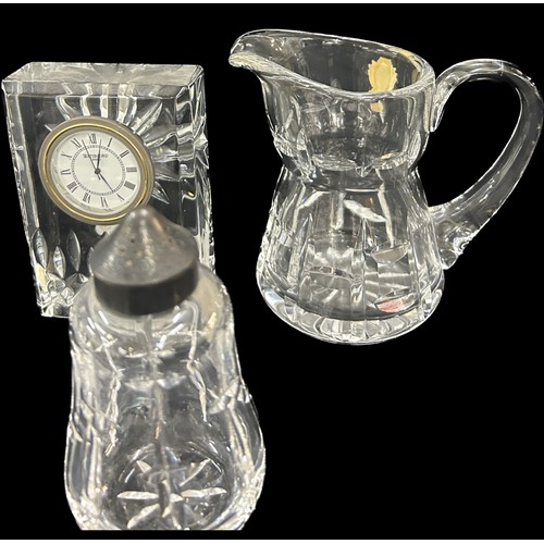 143 - Selection Waterford crystal glass pieces to include 3 mantel clocks, salt and pepper set, small jug,... 