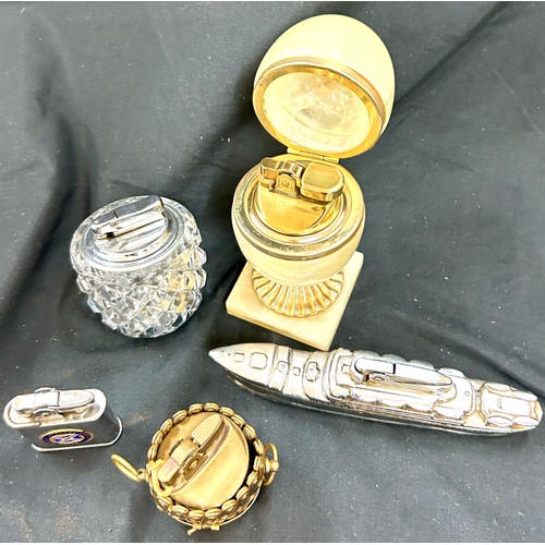 42 - 1950's cruise ship chrome plated table lighter, together with 4 other lighters