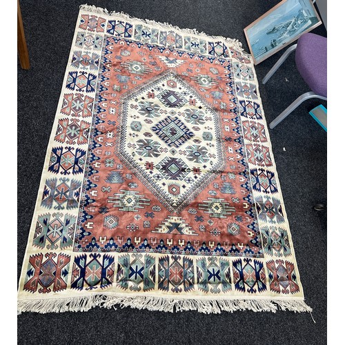 245 - Large lounge rug measures approximately 77 inches long 55 inches wide