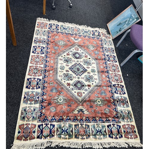 245 - Large lounge rug measures approximately 77 inches long 55 inches wide