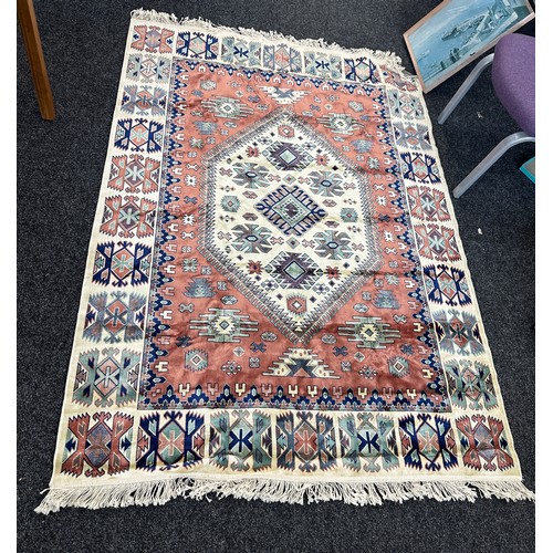 245 - Large lounge rug measures approximately 77 inches long 55 inches wide