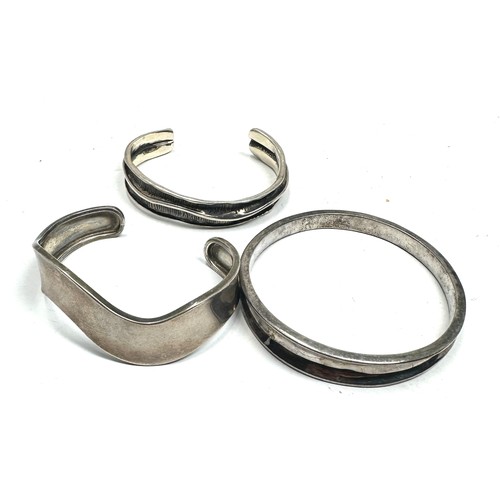 Three Silver Bangles Including Modernist Style