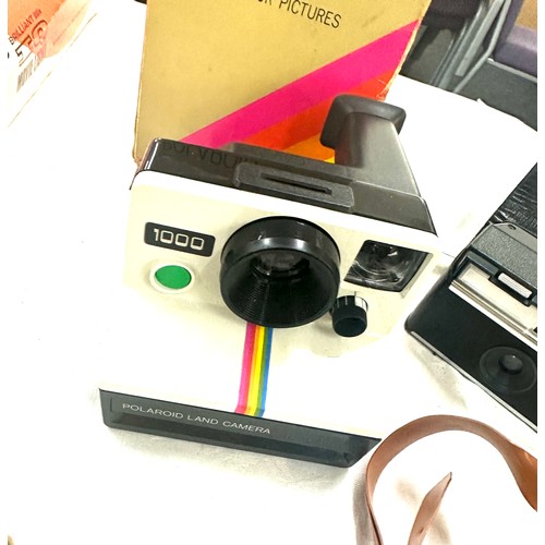 148 - Selection of vintage camera and camera equipment to include Kodak cameras, polaroid 1000 SX-70, Sony... 