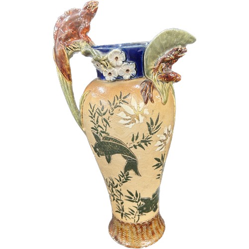 619 - Antique Royal Doulton Lambeth stoneware grotesque ewer, decorated with carps, the body depicting car... 