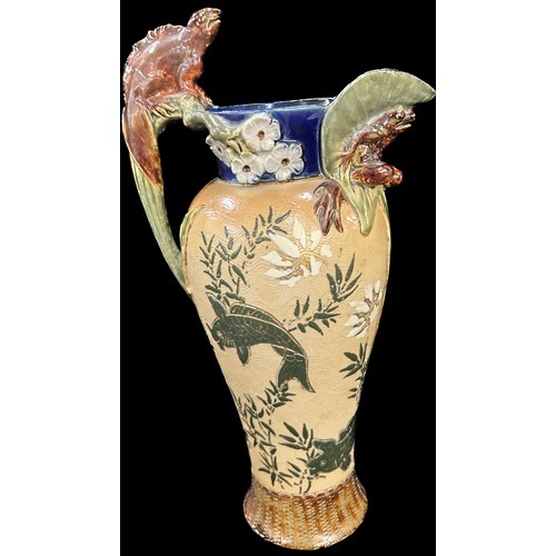 619 - Antique Royal Doulton Lambeth stoneware grotesque ewer, decorated with carps, the body depicting car... 