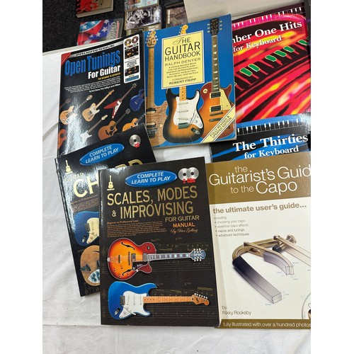 259 - Selection of assorted music books includes Guitar chords, Rock almanac, the guitar handy book etc