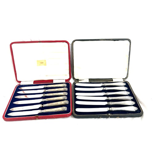 604 - 2 Cased sets of silver handled tea knifes