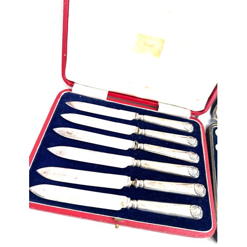 604 - 2 Cased sets of silver handled tea knifes