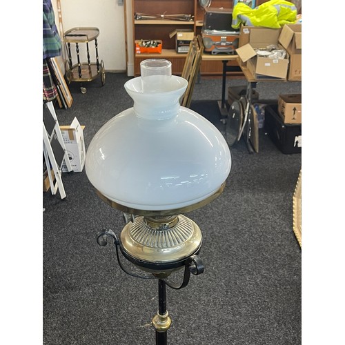 287 - Antique wrought iron oil lamp, extending pole, brass bass oil lamp complete with funnel and shade