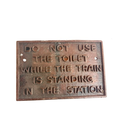 36 - Cast iron warning sign measures approximately 11.5 inches wide 8 inches tall