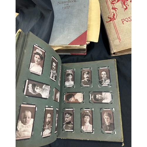 33 - Vintage photo albums with old photographs and a vintage cigarette card album