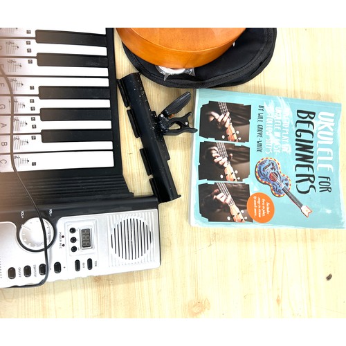 5 - Hand roll piano, tiger ukulele musical instrument, small on air box etc