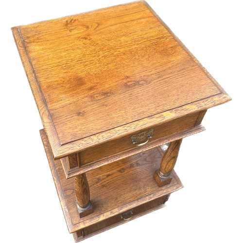 324 - Oak two drawer hall table on casters measures approx 29 inches tall by 17 inches wide and 18 inches ... 