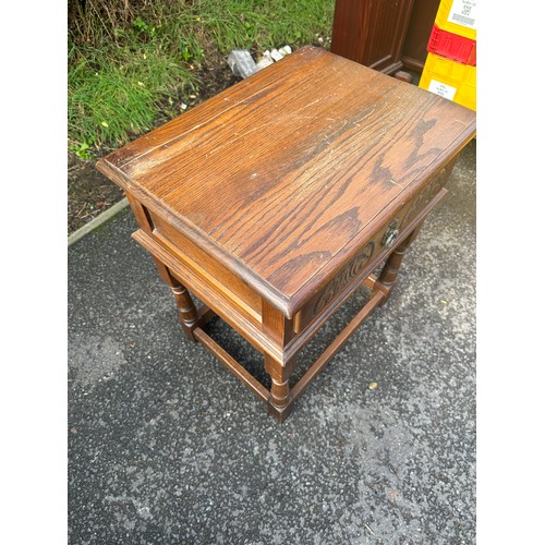 294 - Oak side table with carved drawer measures approx 26 inches tall by 21.5 inches wide and 17 inches d... 