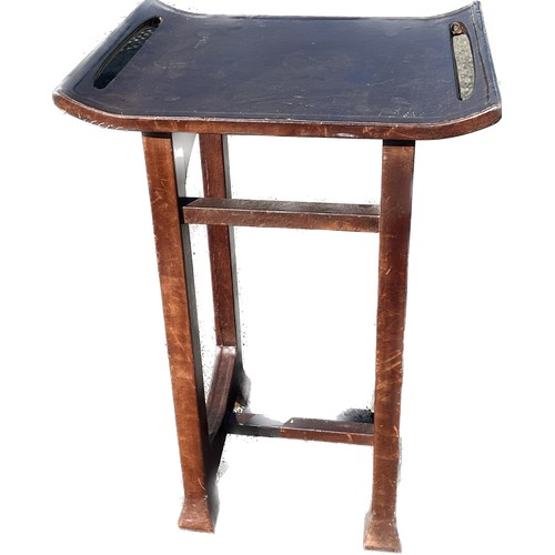 357 - Oriental leather topped table measures approximately 32 inches tall 22 inches wide 16 inches depth